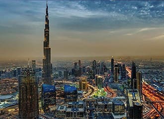 A view of the city from above at dusk.