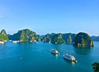 A group of boats floating on top of water.