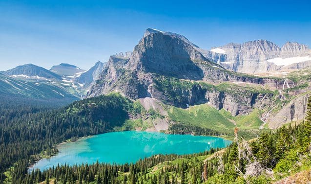 A mountain with a lake and some trees