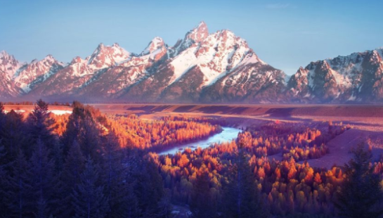 A painting of the grand teton mountains and river.