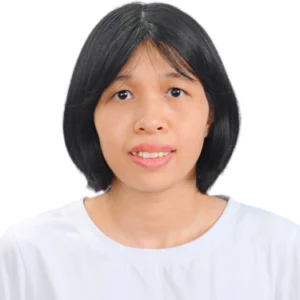 A woman with black hair wearing white shirt.