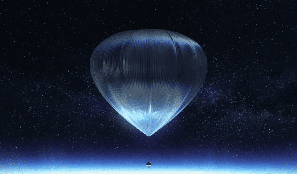 A balloon floating in the sky with a blue glow.