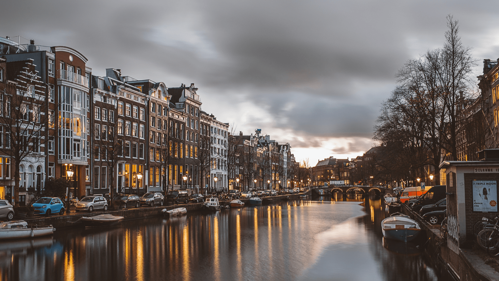 A city with many buildings and boats on the water