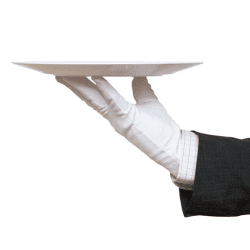 A person in white gloves holding a plate.