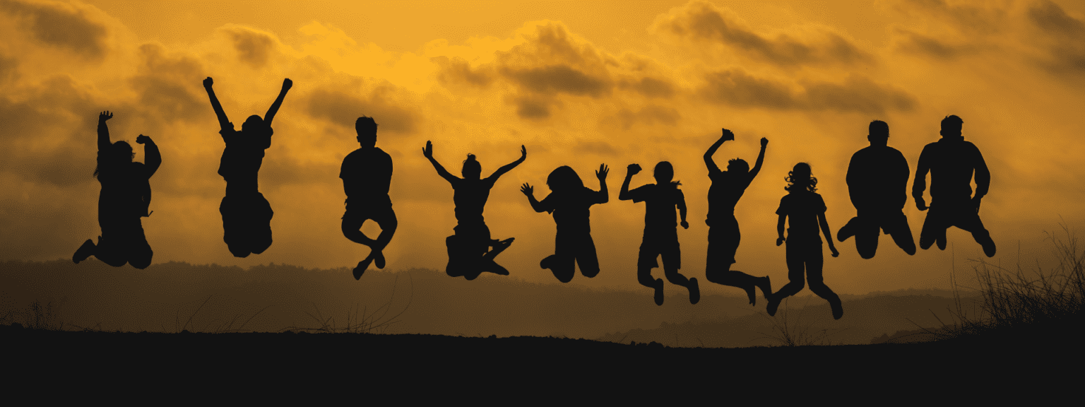 A group of people jumping in the air.