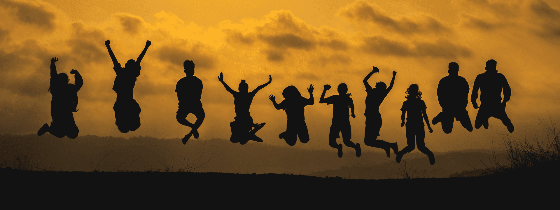 A group of people jumping in the air.